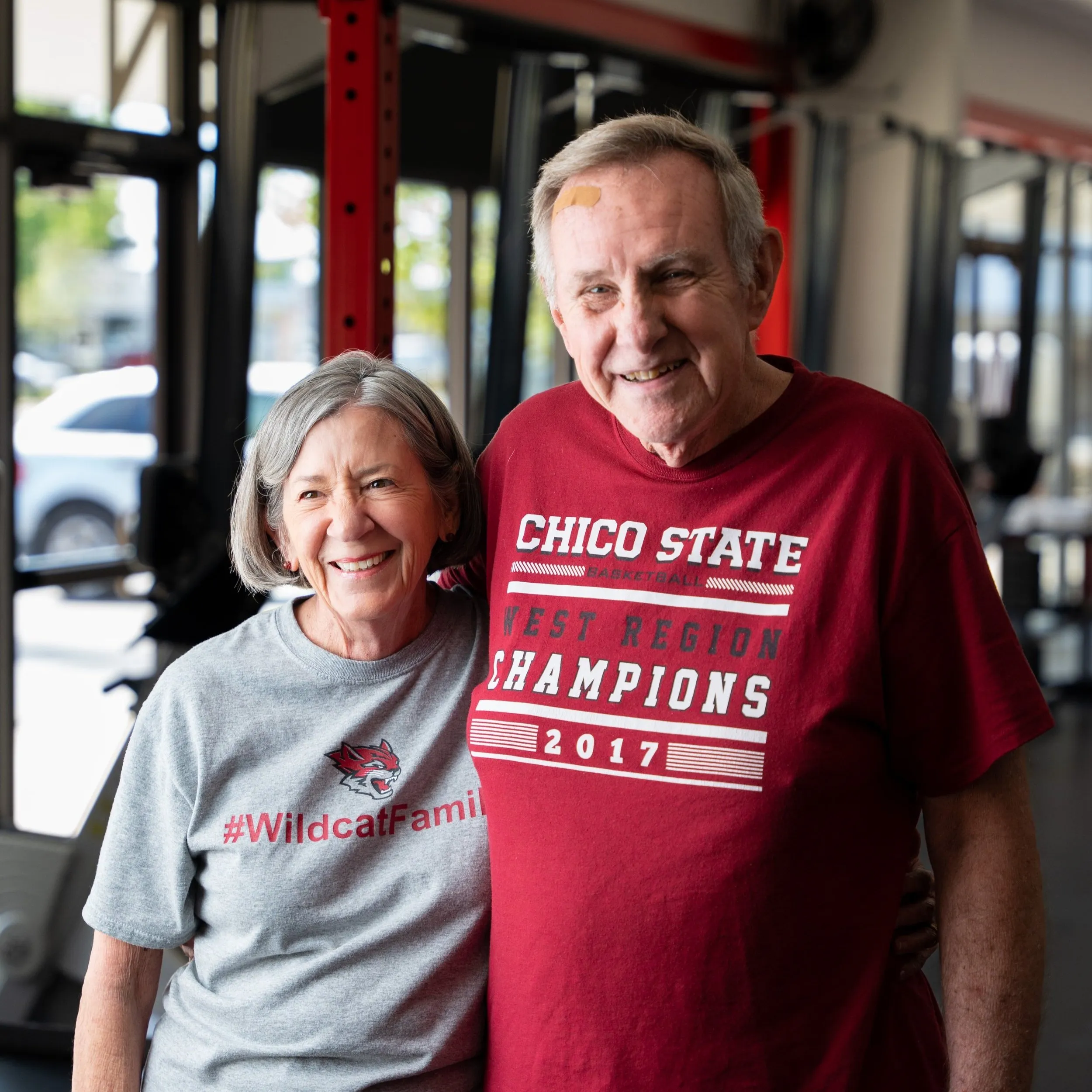 Ken and Sheryl Lange smiling together in the Whole Body Fitness gym
