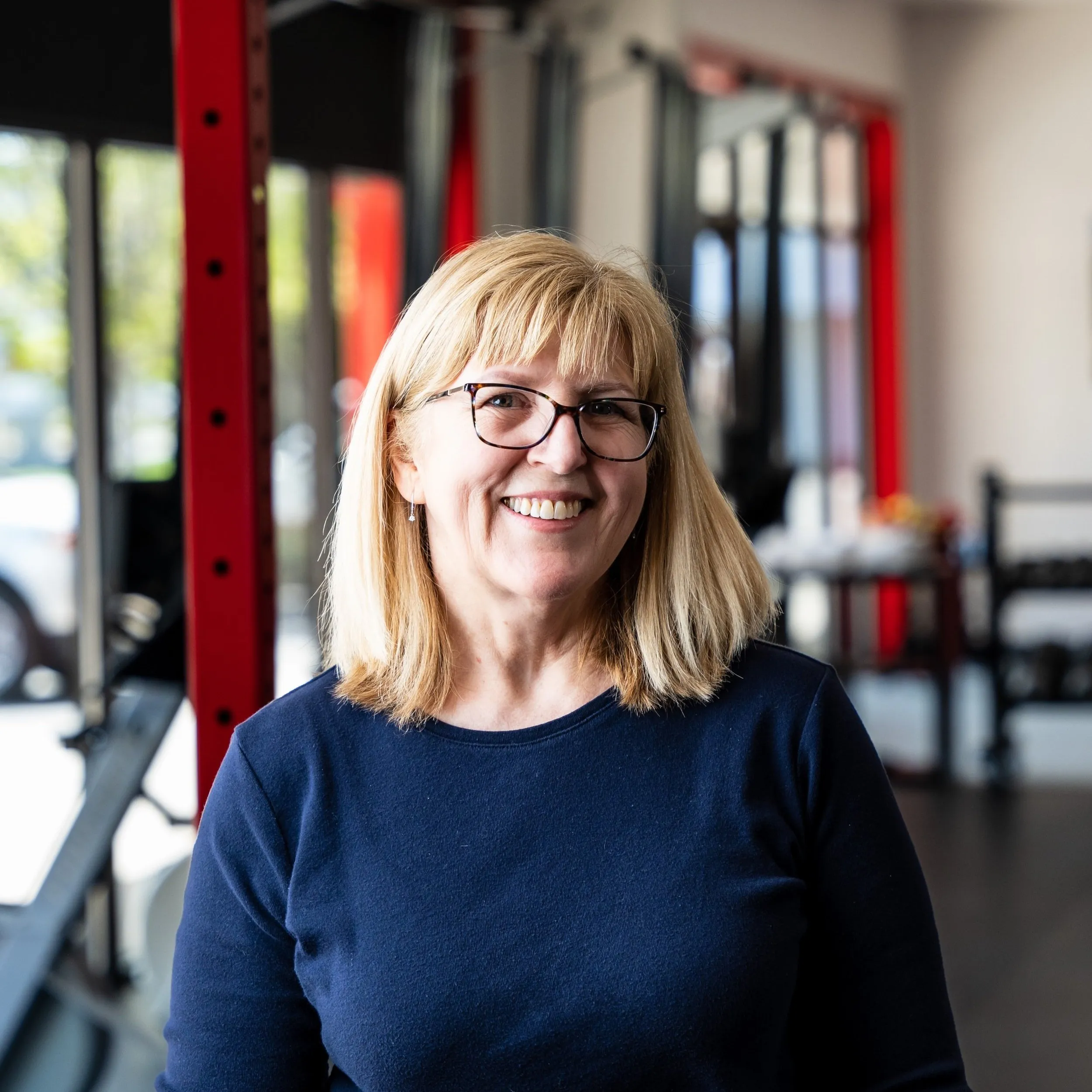 Stephanie Bertoni smiling in the Whole Body Fitness gym