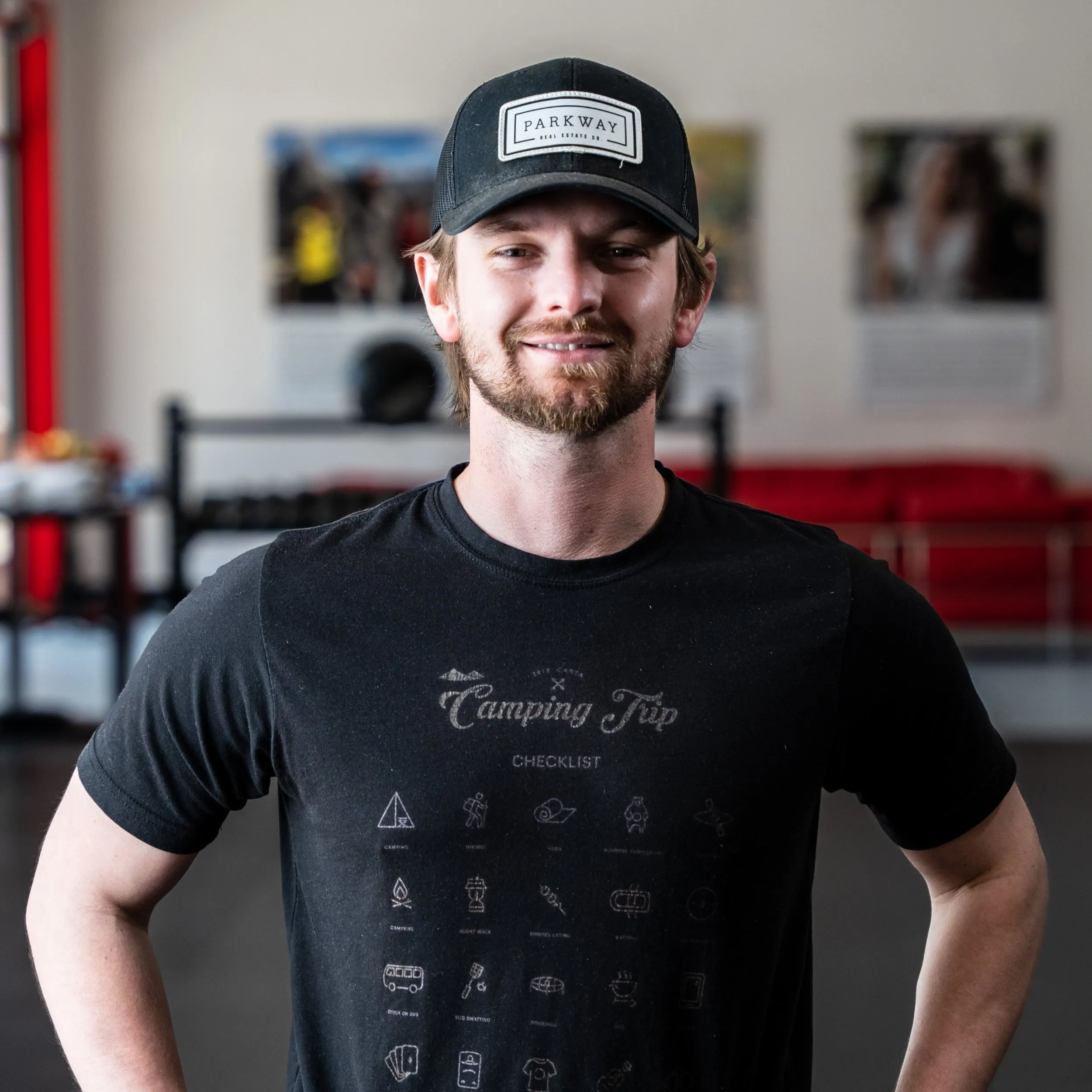 Zach Hutter in a cap, smiling in the Whole Body Fitness gym