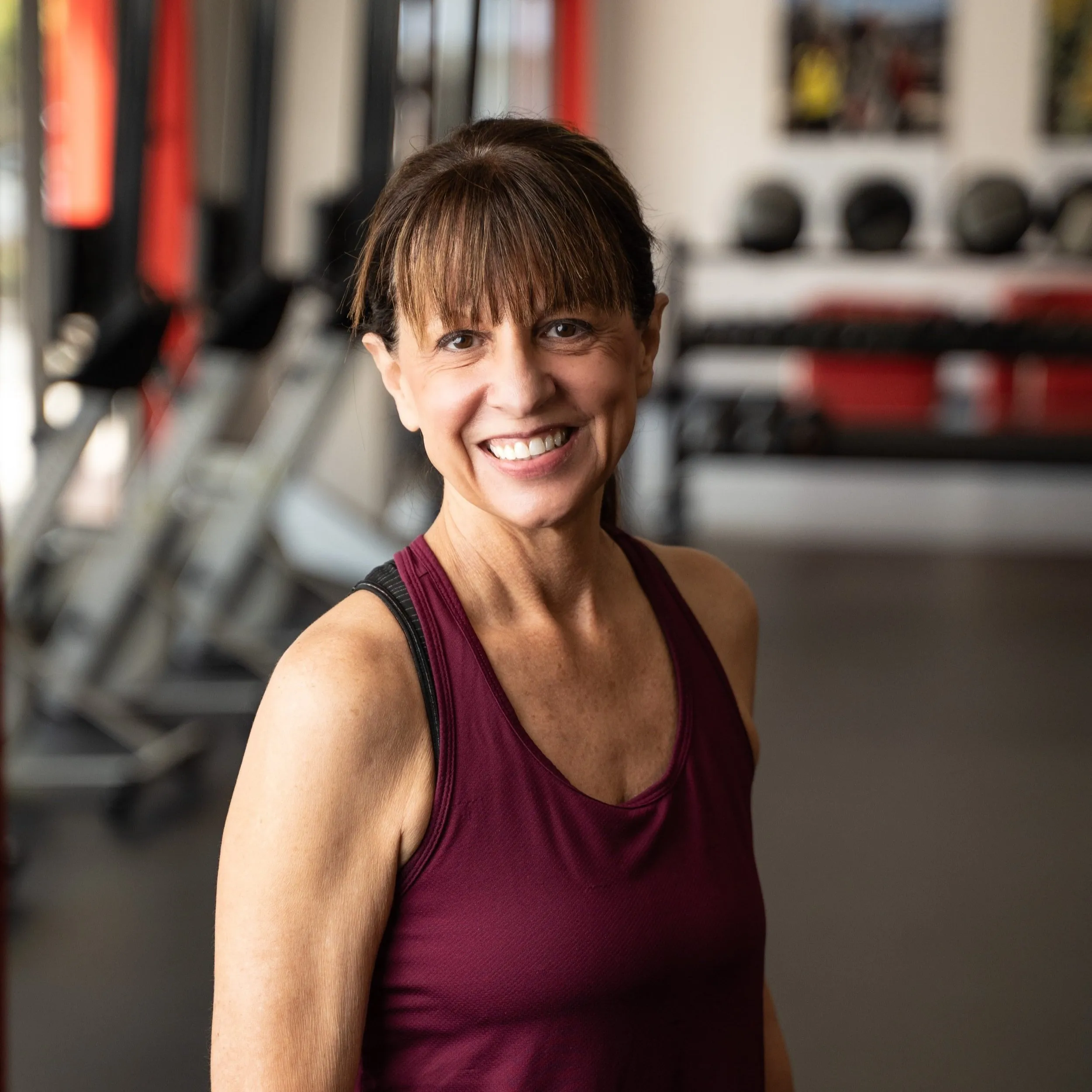 Ronda Unterseher smiling in the Whole Body Fitness gym